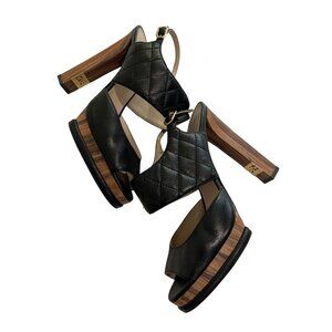 CHANEL Quilted Leather Wooden Sandals in Black